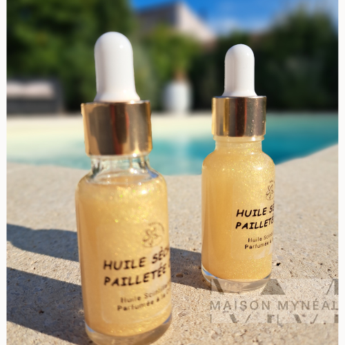 Huile sèche pailletée naturelle or. Des paillettes naturelles pour sublimer votre peau et garder un peu de l'été avec vous